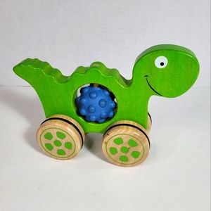 Begin Again Rumblers Dino Wood and Rubber Push and Turn Toy